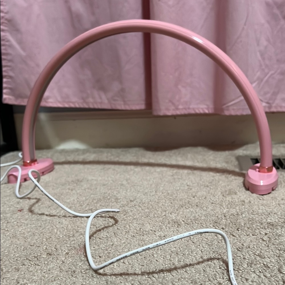 Pink Arch-Shaped Device with Clips